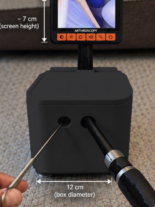 Black arthroscopy training box with screen raised, arthroscope and probe inserted